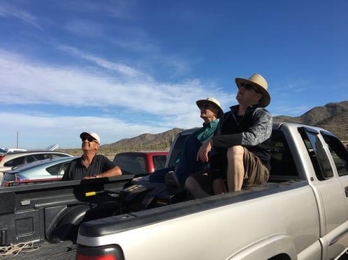 Visitors From Palm Creek Watch The Flying From Their Truck